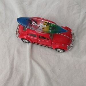 Red Toy Car with Surfboard